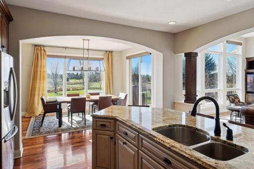 View of the dining area with the scenic views to the backyard. Once again, plenty of natural light that highlights the homes beautiful features.