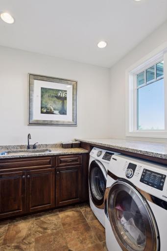 Laundry is on main floor with storage for all laundry needs.