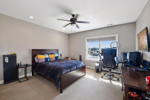 Fourth spacious bedroom on the lower level. Great views of the pool and pool deck area.