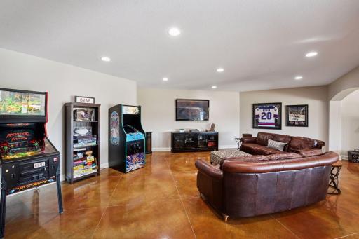 This basement has fun throughout. Plenty of space to add whatever you desire. Multiple TV and watch areas so if people in the house have different shows/movies they want to watch at the same time.