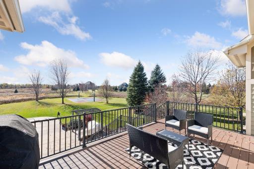 Deck view of the backyard. There is multiple places to grill at and this is one of them.