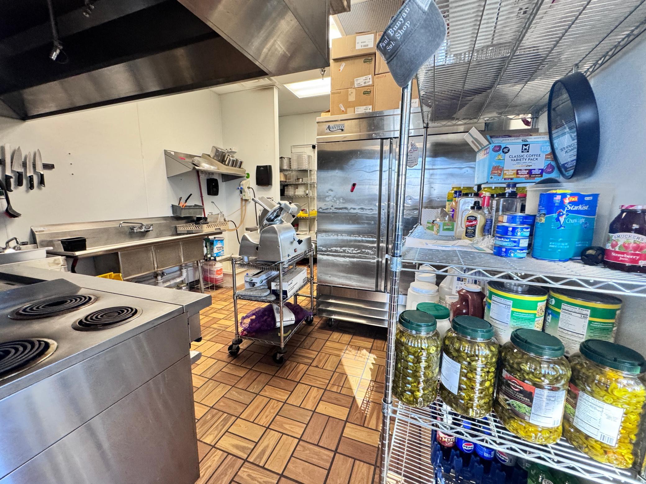 A glance into the back kitchen from the side employee door
