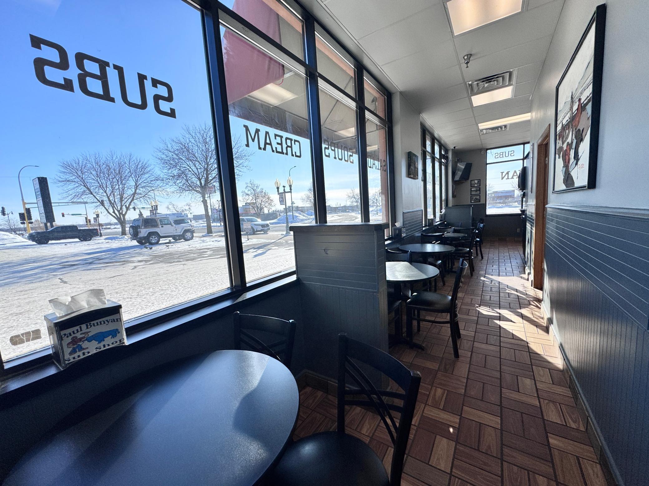 This seating area is off to the side. While many customers take their sandwiches to go- it still has room for those who prefer to dine in. Ask about what the current owner intended to do with this area!!