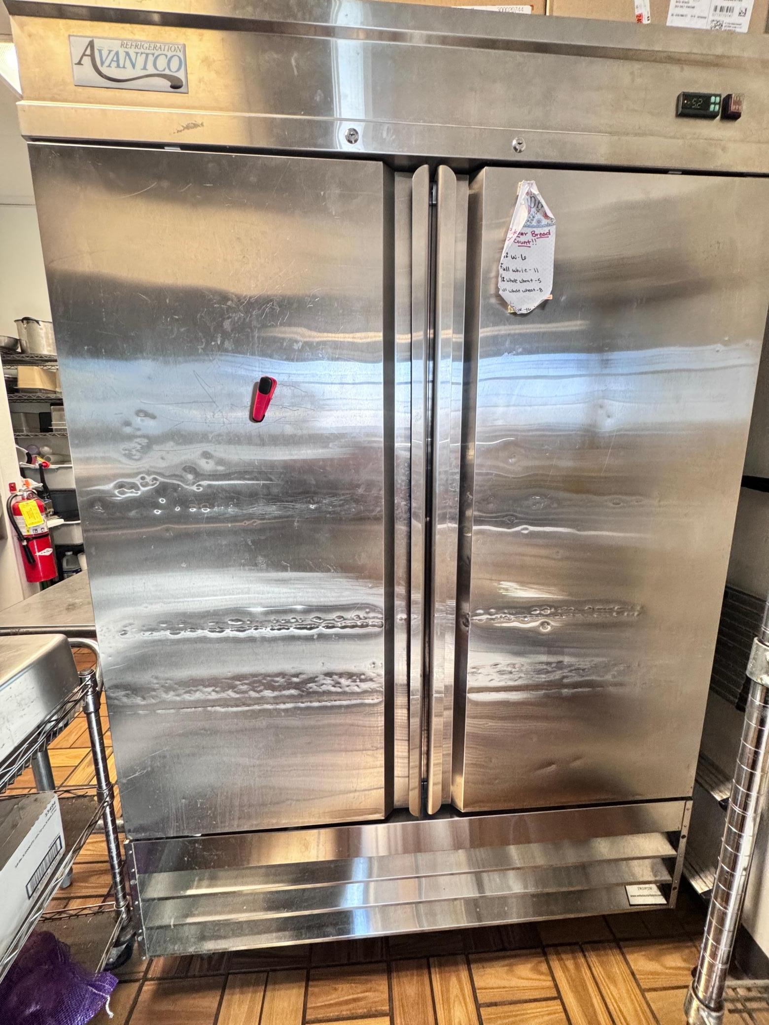 Upright freezer has lots of storage space.