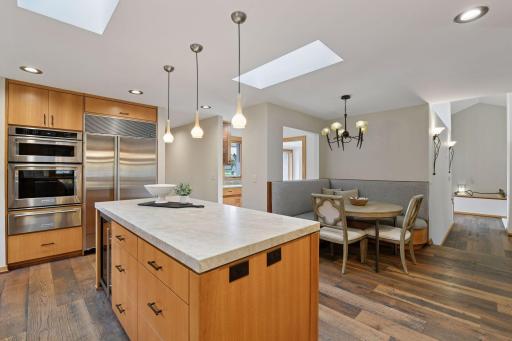 Built-in bench seating provides an inviting breakfast nook space in the kitchen
