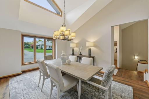 Vaulted ceilings and natural light provide visual interest in the dining room