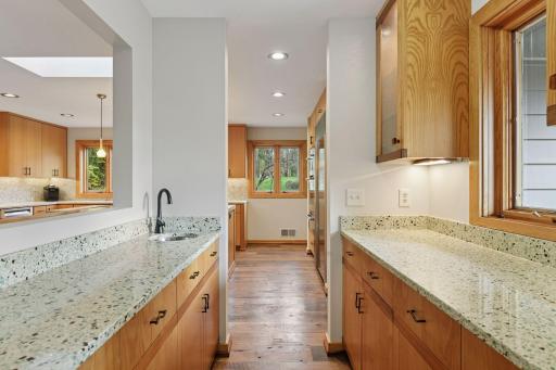 A spacious wet bar area between the kitchen and formal dining areas comes in handy when entertaining