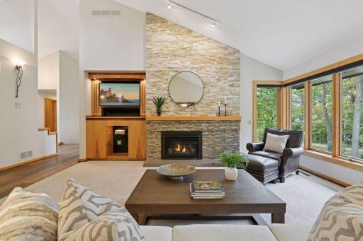 Admire the floor-to-ceiling tiling surrounding the fireplace