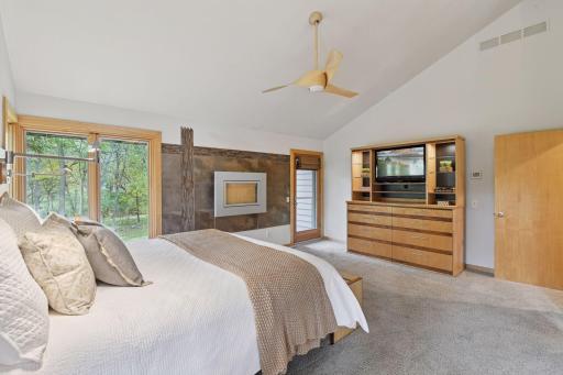 Cozy gas fireplace, private balcony, and wonderful outdoor views give this space a tranquil feeling