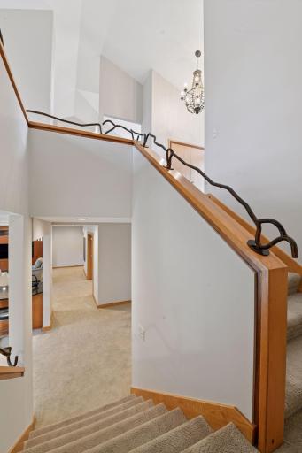 Creative wrought-iron handrail adds a sense of artistic flair in the stairwell