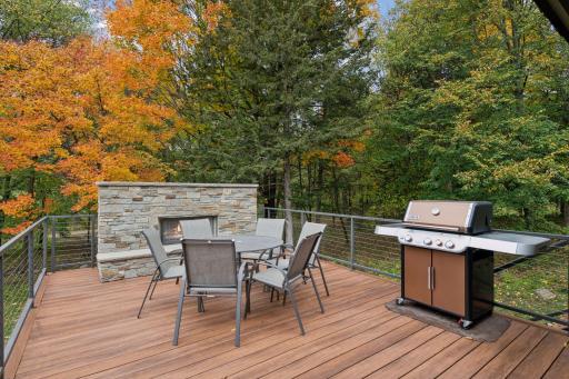 A gas fireplace and park-like setting offer a relaxing environment to enjoy the deck space