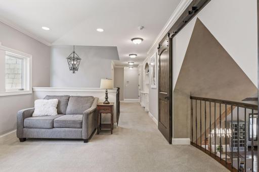 Upstairs, you will find three spacious bedrooms, two bathrooms, laundry and loft.