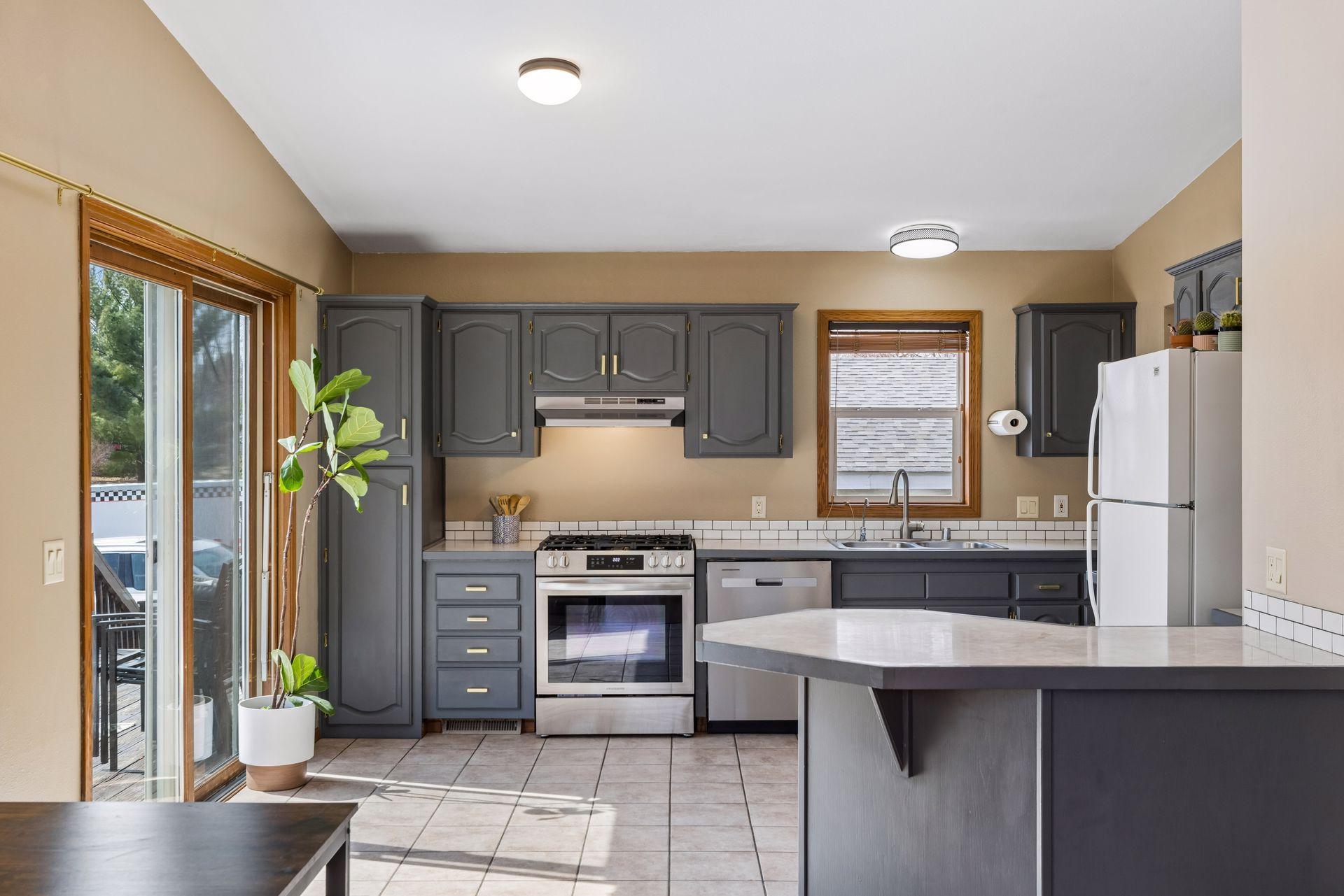 Newer stainless steel stove, vent hood, and dishwasher