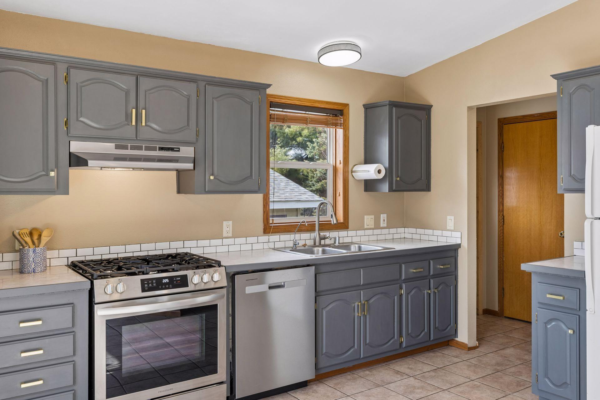Stainless steel dishwasher, stove and vent hood all new within the last two years