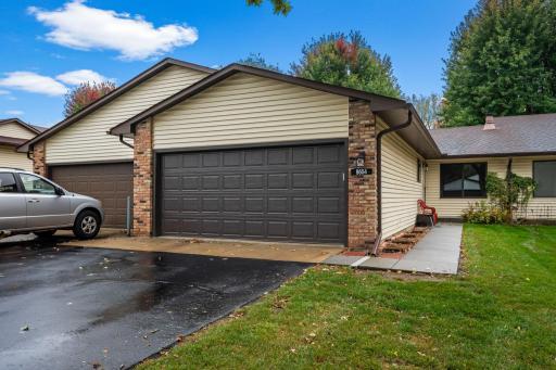 Large front yard features mature trees ample parking
