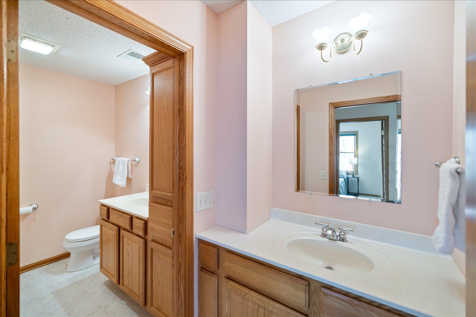 Upper level full bathroom with dual sinks