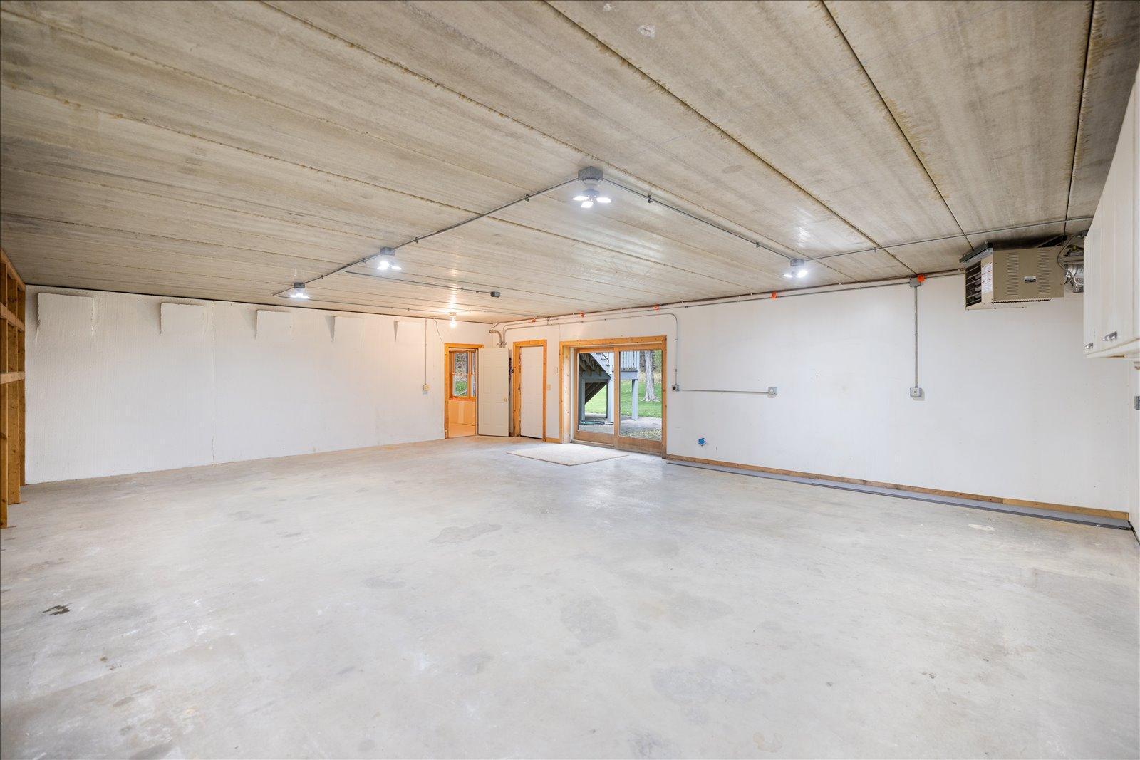 Lower level heated workshop/garage with 3 spaces