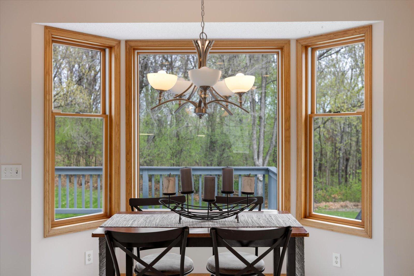Bay window in dining room overlooks backyard