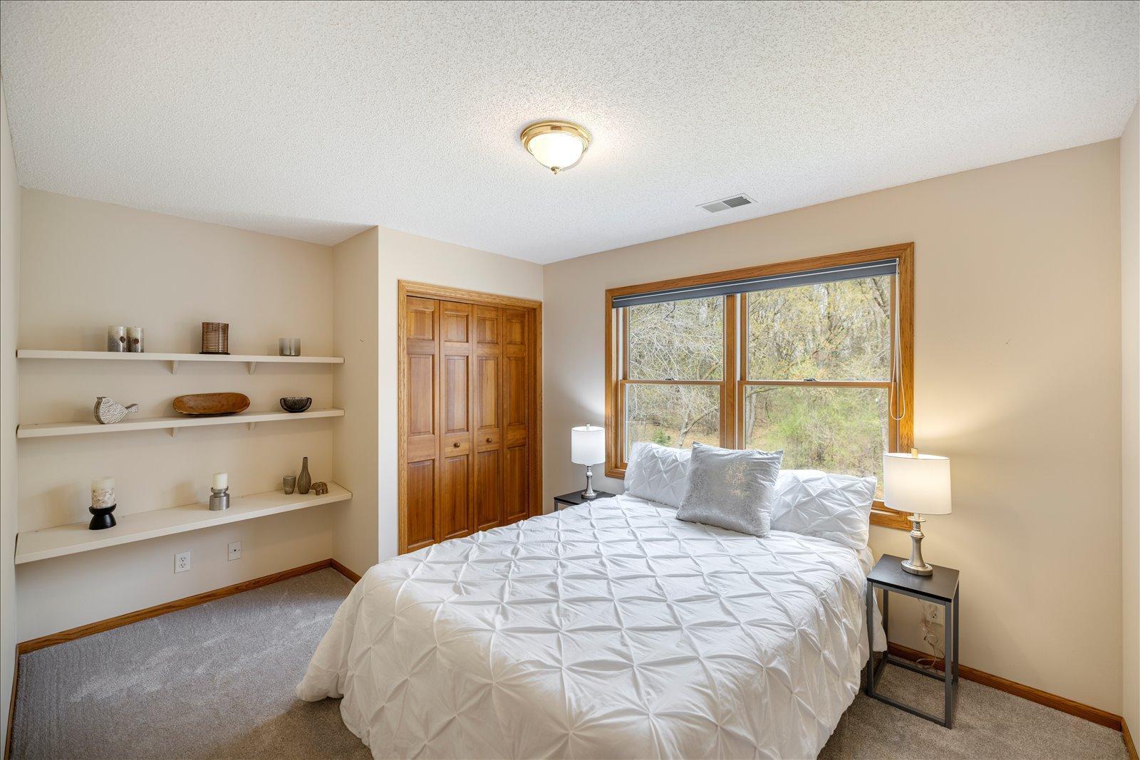 Third upper level bedroom overlooks backyard