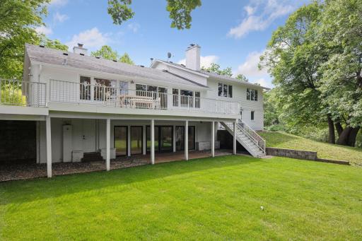 Lower level walk-out to flat yard, and newly sodded grass.