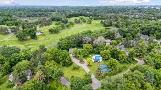 West facing back yard overlooks serene green golf course in the distance
