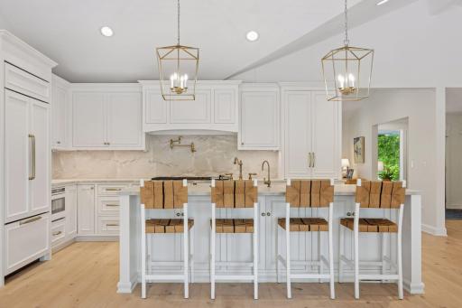 Quartzite Countertops, custom cabinetry with soft shut drawers and cubboards