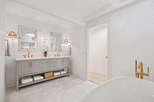 Stunning, custom vanity with luxury lighting and hardware.