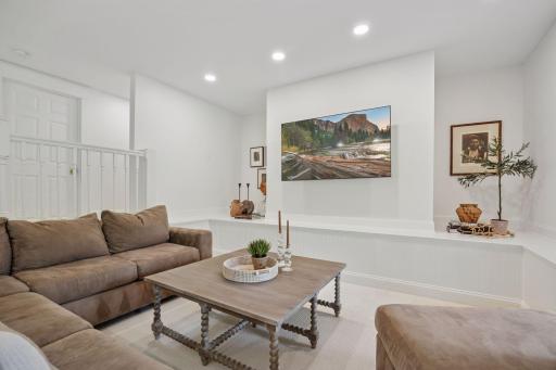 Cozy gathering area w enough room for a pool or ping pong table.