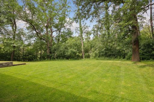 Beautiful, newly sodded flat, back yard! great for entertaining, perhaps a pool with the proper approvals.