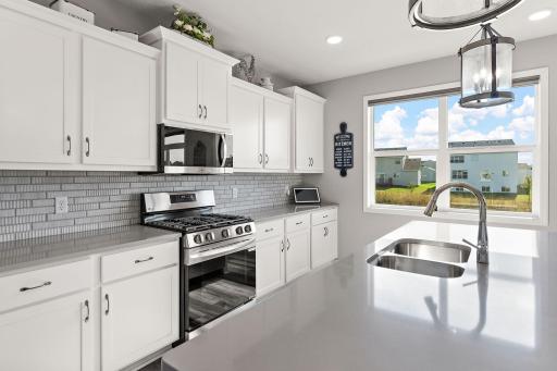 Photo for 2680 Ivy Avenue NE, Saint Michael, MN 55376 - listing #6806200 Tiled backsplash, canned lights, all SS LG appliances, garbage disposal and pull-out trash/recycle bin off the lovely quartz island