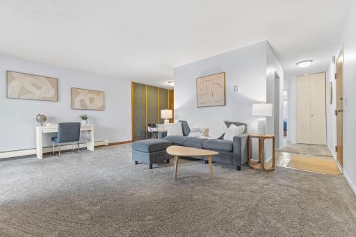 Photo for 12992 Nicollet Avenue, 102, Burnsville, MN 55337 - listing #6806274 Bright and inviting living space with fresh paint, plush carpeting, and an open layout perfect for relaxing or entertaining. Flexible floor plan includes a potential dedicated workspace and cozy seating area.