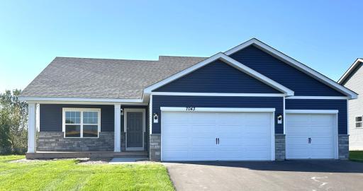7043 Marlowe Ave NE features the timeless American Classic exterior facade. Perfect for its covered front porch and stone accents. *Picture is of actual home.