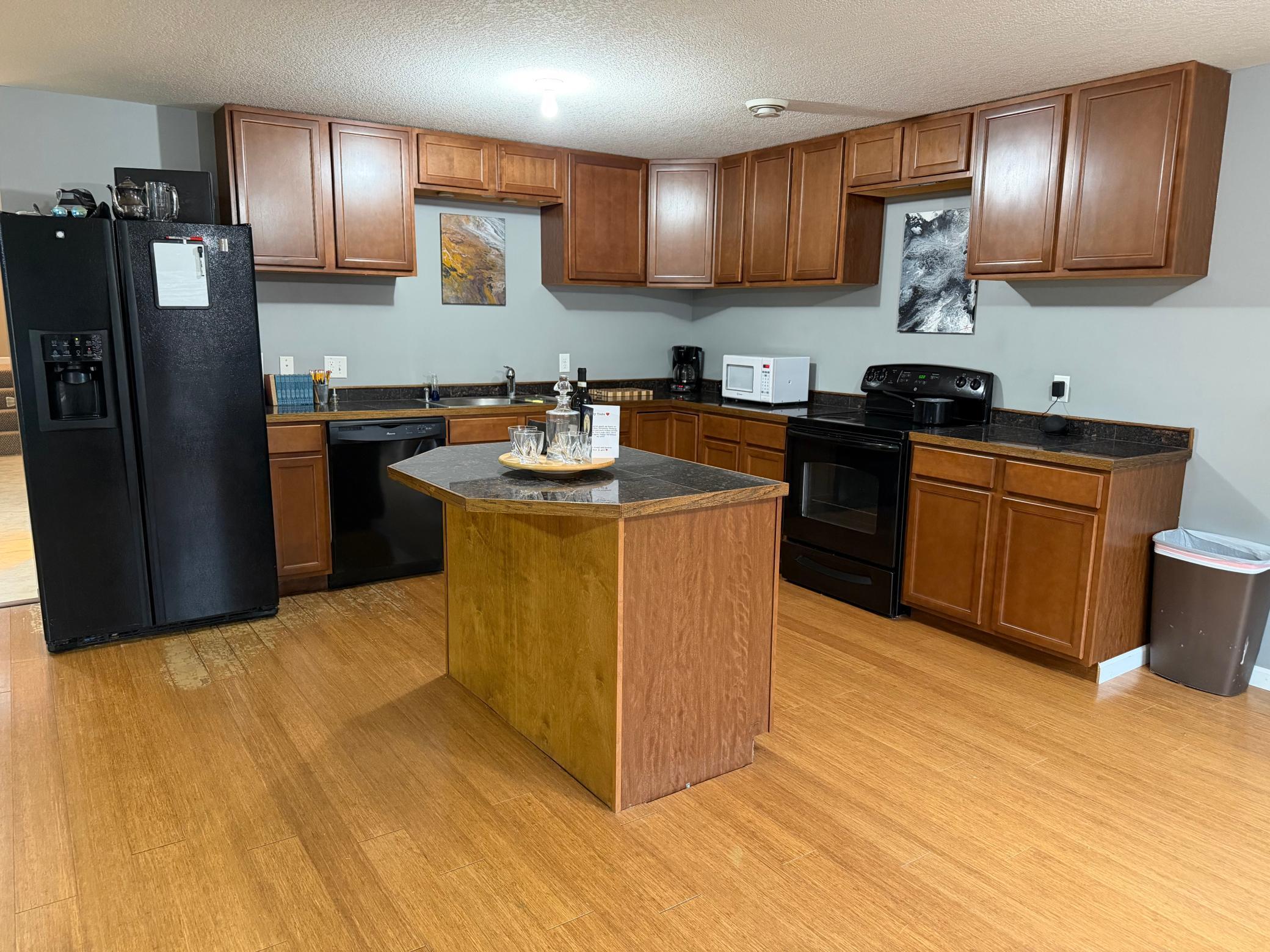 Full kitchen downstairs has a center island.