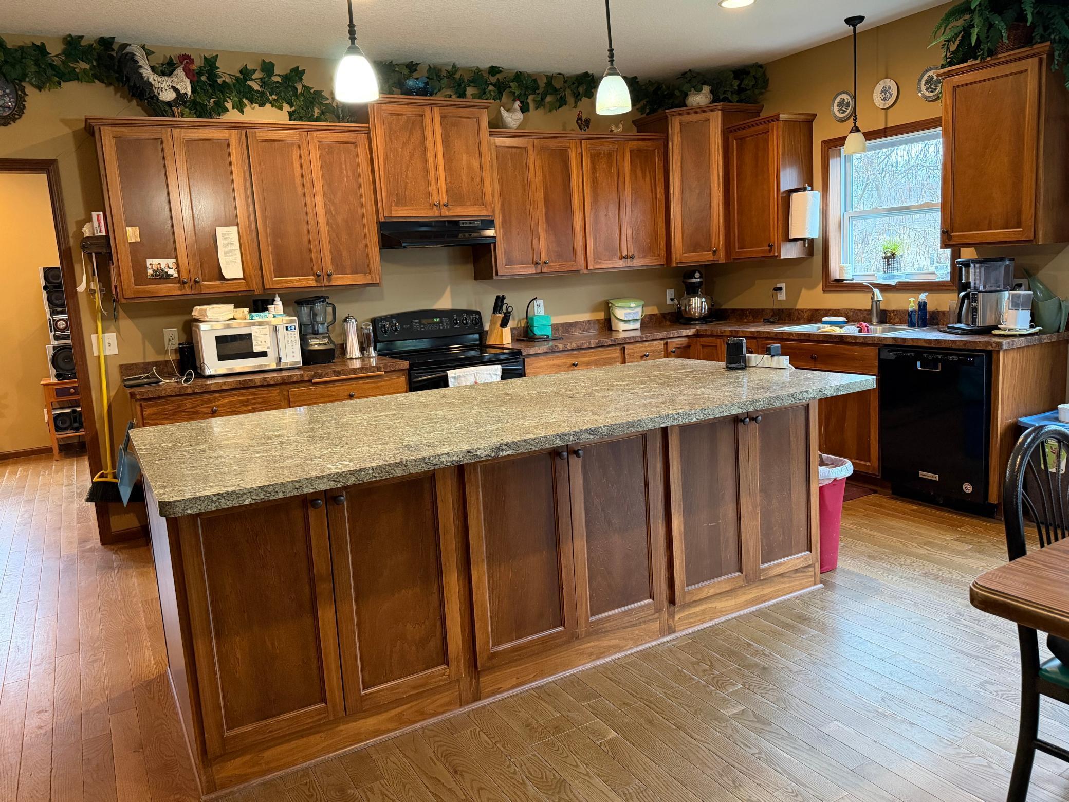 Part of the kitchen, this center island with seating is 12' long. Awesome cabinets on the other side.