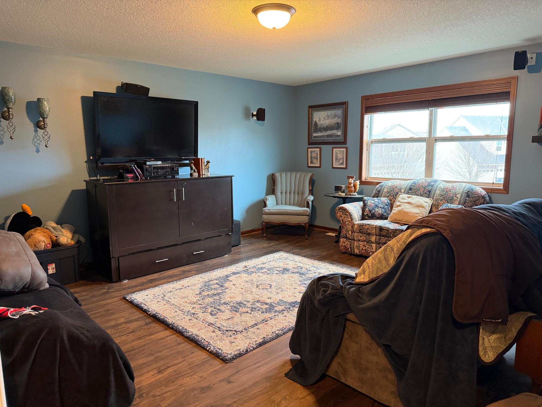 French doors lead to the media room upstairs. Great den or another living space. There is also a huge walk in closet in the hall for additional storage.