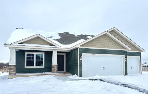 7085 Marlowe Ave features the desirable Northern Craftsman elevation with accent shakes in peaks and covered front porch. *Picture is of actual home.