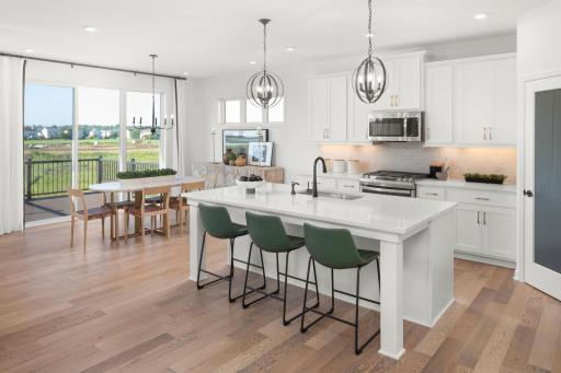 Welcome home to your new Amelia Floorplan! Cook your favorite meal while entertaining your guests in this open concept floorplan. (Photos of model, colors and materials will vary in actual home.)