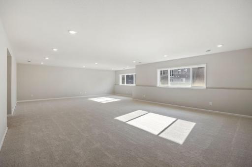 Spacious and bright lower level reacreation room.