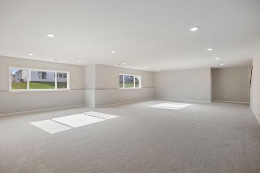 Lower level recreation room with daylight windows