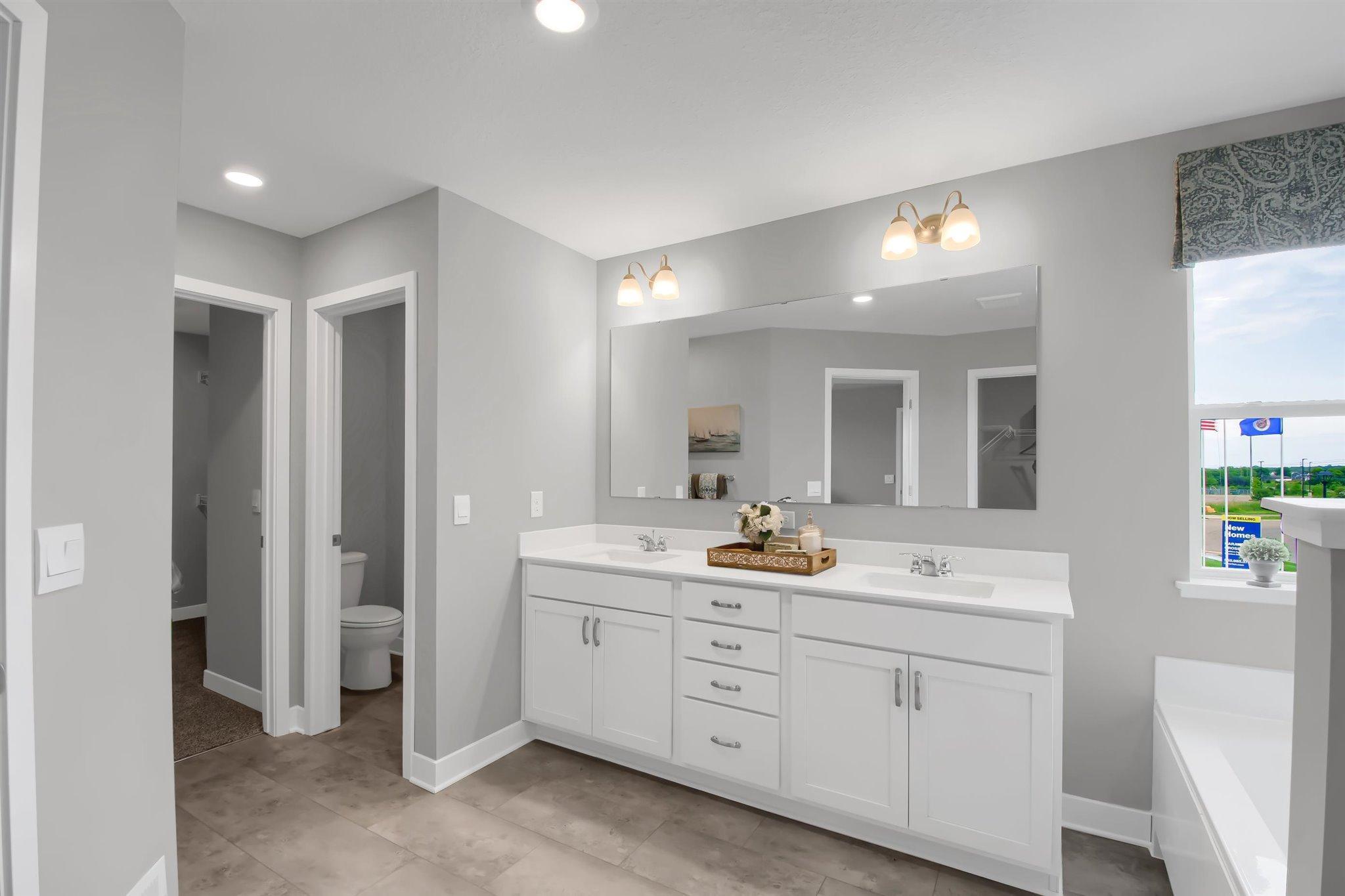 Primary bathroom also offers TWO walk in closets.