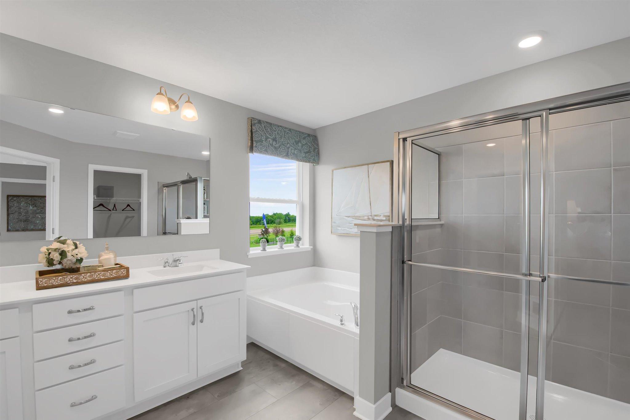 Primary bathroom offers high end finishes.