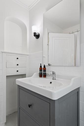 A full bathroom completes the upper level and has been refreshed with a new vanity and fixtures.