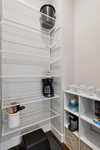 Just next to the main level laundry is a walk-in pantry providing additional storage.