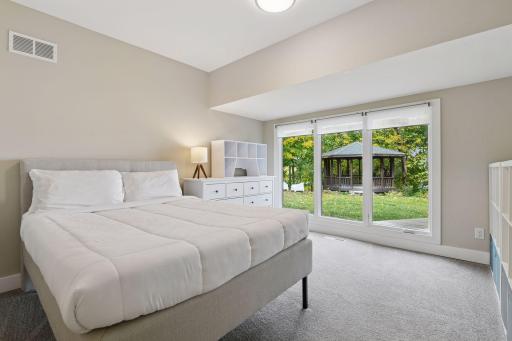 The second main level Bedroom also enjoys lake views.