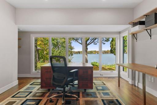 Glass French Doors open to a tranquil Home Office where working from home becomes a peaceful experience.