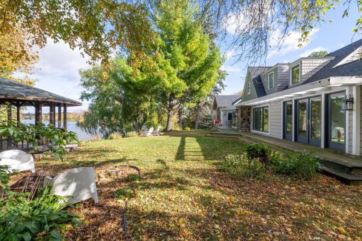 Surrounded by mature trees, the private yard offers a large level space perfect for a game of soccer!