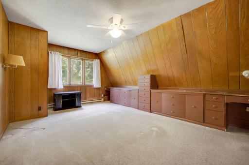 Main floor bedroom with built-in storage.