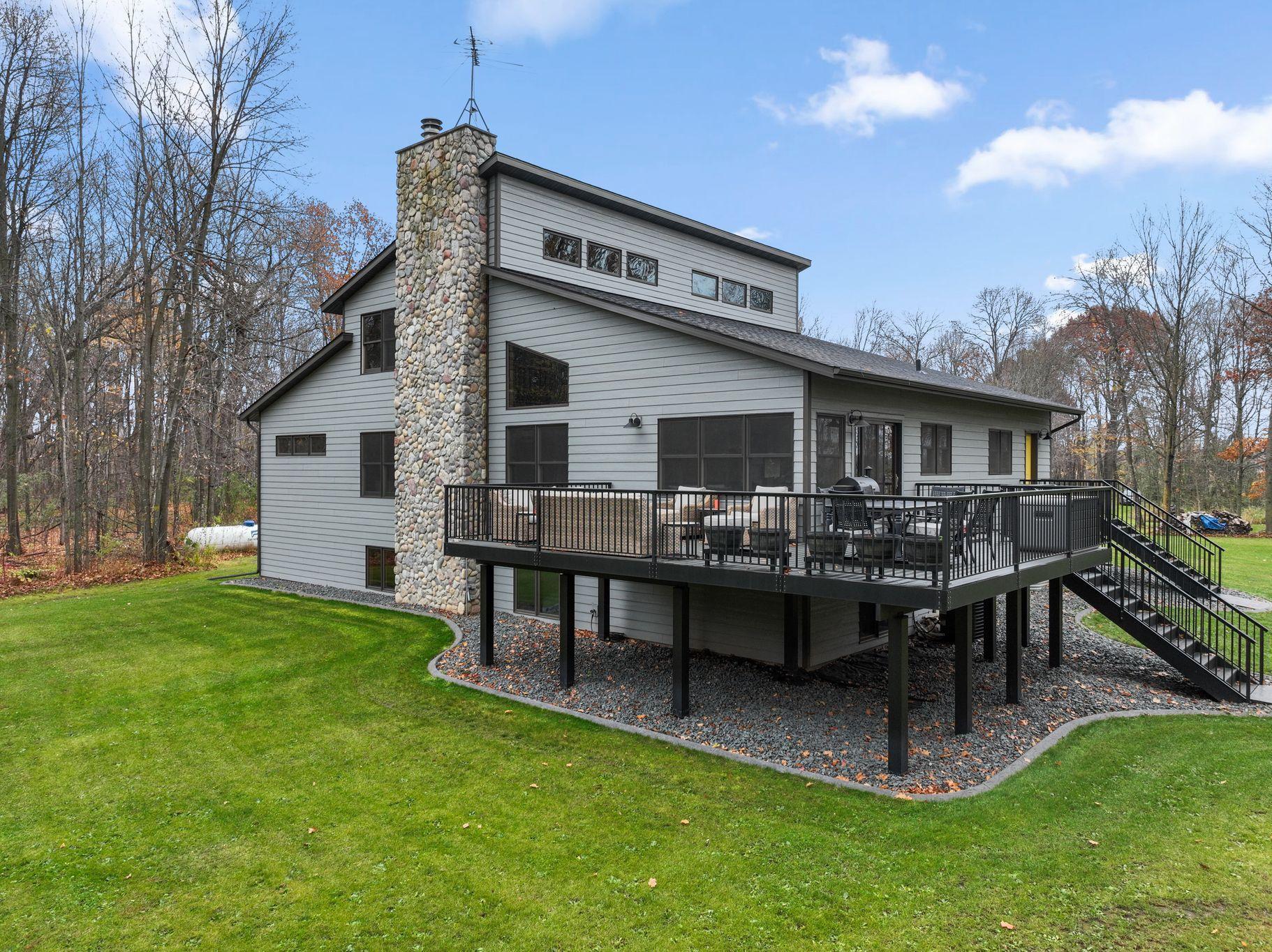 The yard was newly graded, seeded, irrigation installed, stamped concrete curbing and trap rock all completed in 2024.