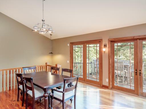 Dining Area leads to Front Deck and open stair to Lower Level.