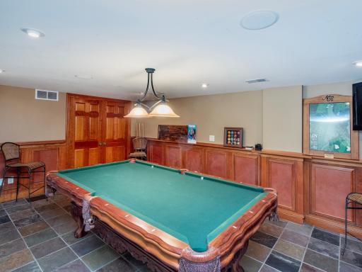 Enter the home on the Lower Level and enjoy the spacious family room, bar, recreation area and fireplace.